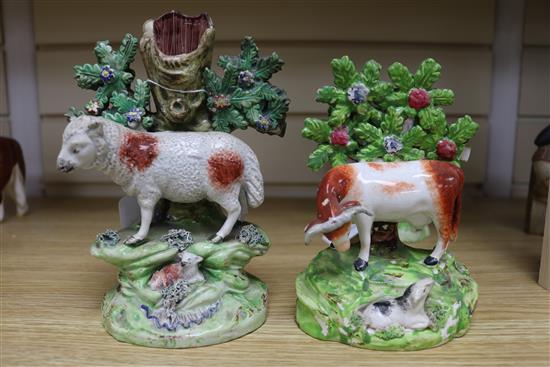 A Walton pottery sheep and lamb spill vase, two Staffordshire pottery cow and calf groups & a Staffordshire of a youth and his dog (4)